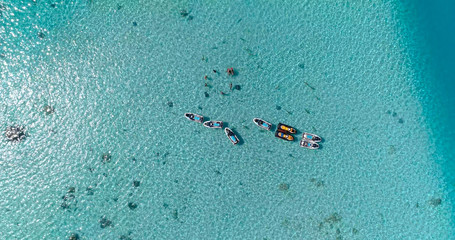 snorkeling in a dream lagoon in French Polynesia, in an aerial view