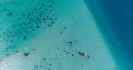 snorkeling in a dream lagoon in French Polynesia, in an aerial view