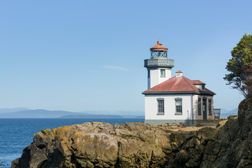 Fototapeta na wymiar Lighthouse on shore in San Juan Island