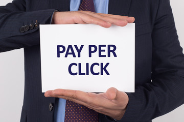 Man showing paper with PAY PER CLICK text
