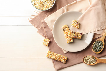 Obraz na płótnie Canvas Flat lay composition with grain cereal bars on table. Healthy snack
