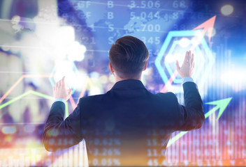 Back view of Caucasian young man in navy blue suit pointing, isolated on white