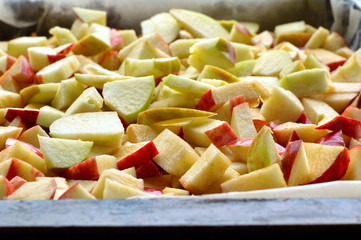 Freshly sliced apples in a baking dish