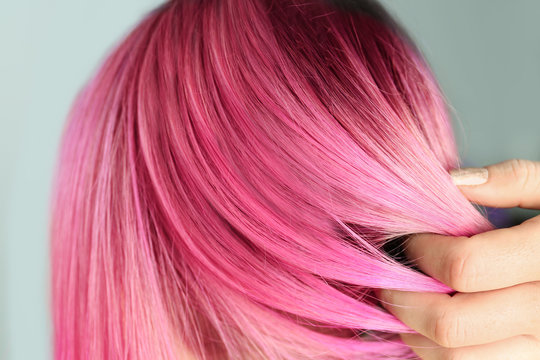 Woman with color dyed hair, close up view. Trendy hairstyle