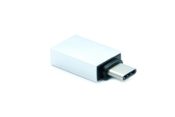 Gray metallic Thunderbolt adapter for computer isolated on white background. It transfers Thunderbolt to the USB. The lying position.