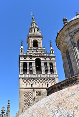 City of Seville in Andalusia, Spain, Gothic architecture of Sevilla Cathedral, rooftop, dome and Giralda Tower at background