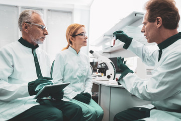 Professional bioengineer. Professional bioengineer feeling engaged in teaching his promising...