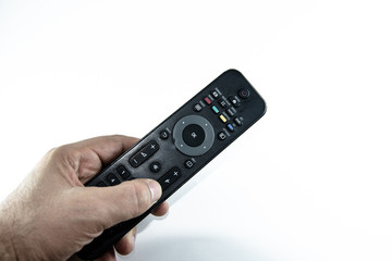 man holding television remote control isolated on white background