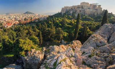 Greece, Athens, a view of the Parthenon, a city and a park with pines and cypresses