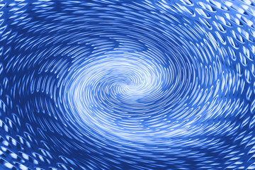 Blue wormhole in form of spiral absorbs space. Fantastic background image of asymmetric vortex tunnel in center of shot in cobalt color.
