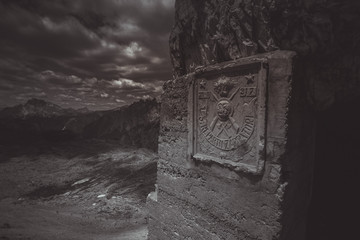 Italian military banner of the First World War at the entrance to a post on Mount Paterno, Tre Cime di Lavaredo, Dolomites, Italy