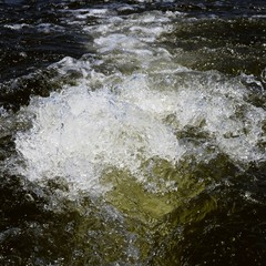 water boat wake churning from motor to surface
