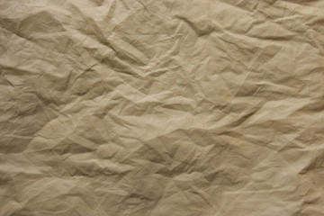Crumpled beige textile surface, texture for background