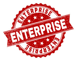 ENTERPRISE seal print with distress texture. Rubber seal imitation has round medallion form and contains ribbon. Red vector rubber print of ENTERPRISE caption with corroded texture.