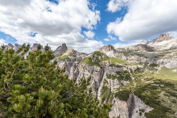 Dolomite peaks sprouting from green meadows, Dolomites, Italy