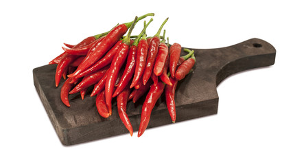 Red hot chili peppers on wooden Board on white isolated background