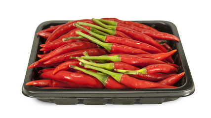 Red hot chili peppers in black tray on white isolated background