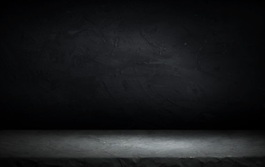Dark room with tile floor and brick wall background
