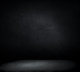 Dark room with tile floor and brick wall background