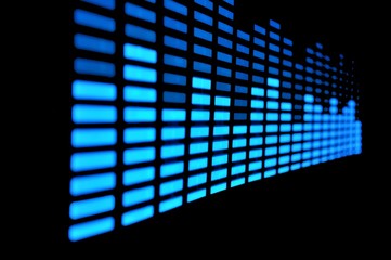 Luminous panel of pixels, with neon blue color and an equalizer on a black background