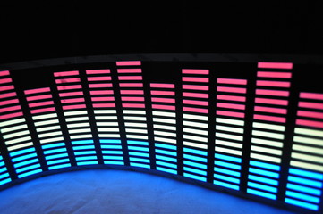 Light panel of pixels, neon with blue or green, yellow and red, a bright equalizer on a white background