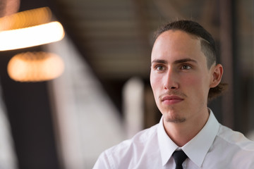 Portrait Of Young Handsome Businessman Thinking