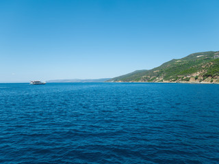 Fototapeta na wymiar Ship sailing across the Aegean Sea. Athos, Greece
