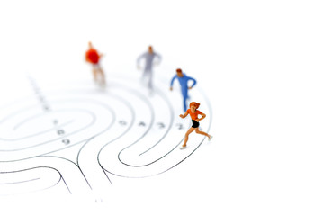 Miniature people : marathon runners on maze ,jogging and running,Active and healthy lifestyle concept.