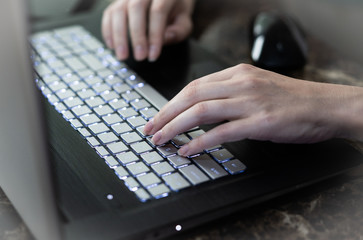 Fototapeta na wymiar Hands typing on keyboard
