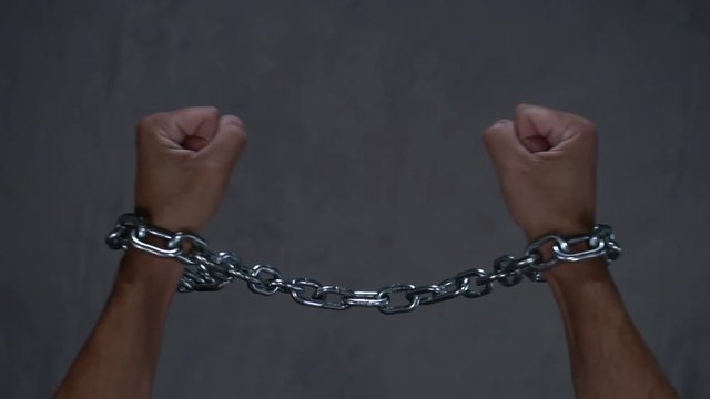 Freedom, concept of free man, broken chain in slow motion
