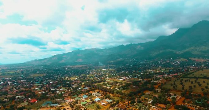 Aerial clip of Morogoro Town, Tanzania, with blue sky and clouds in the background.