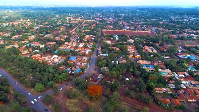 Aerial clip of Moshi City, Tanzania. with a blue sky in the background.