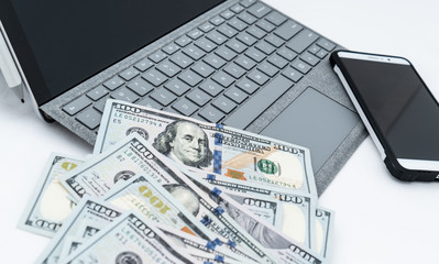 laptop computer and money 