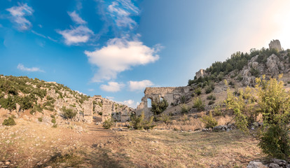 Fototapeta na wymiar With blue sky,High resolution panoramic view of aqueducts or water bridges at Olba Ancient city located in Uzuncaburc,Silifke,Mersin,Turkey..