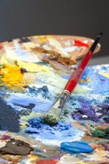 Fototapeta premium An artists paint palette and brush
