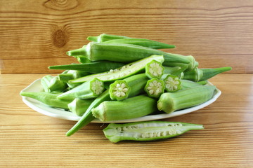 fresh okra vegetable in wooden table background
