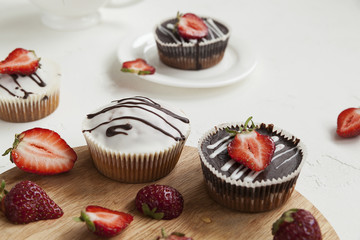 chocolate cupcakes with strawberries, muffins and fresh strawberries