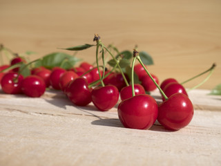 fresh cherry group with leaves on wooden table