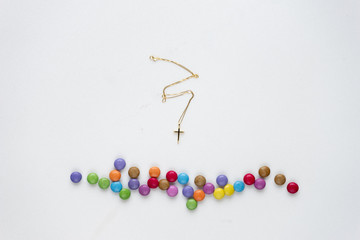 Golden cross on marble background