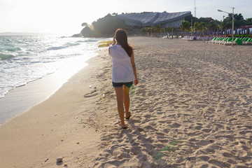 alone woman walk on the beach