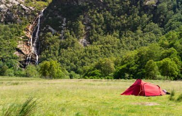 Camping in Front of Waterfall Steall Falls in Summer Scotland UK