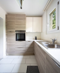 Modern kitchen with wood and a window where a lot of light enters