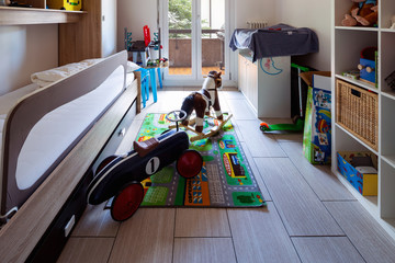 Child bedroom with many games on the ground