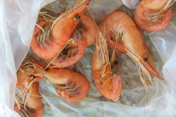 Boiled shrimps with caviar in a package.