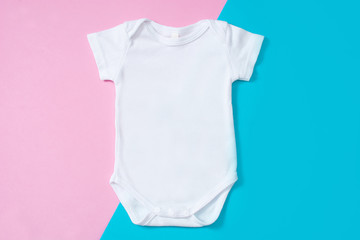 White baby romper mockup on pink and blue background.       © chandlervid85