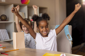 Fototapeta premium Girls finished homework celebrating