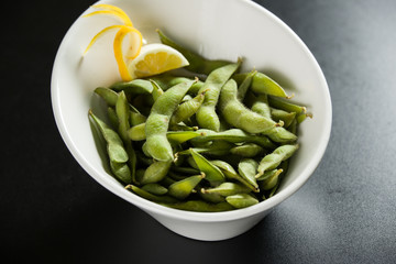 Green Edamame in a white bowl