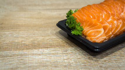 Salmon raw sashimi on wooden table, japanese food Closed up.