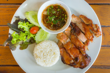 Grilled chicken cut into pieces on a white plate