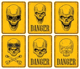 Skulls on sign danger. Black vintage vector illustration.